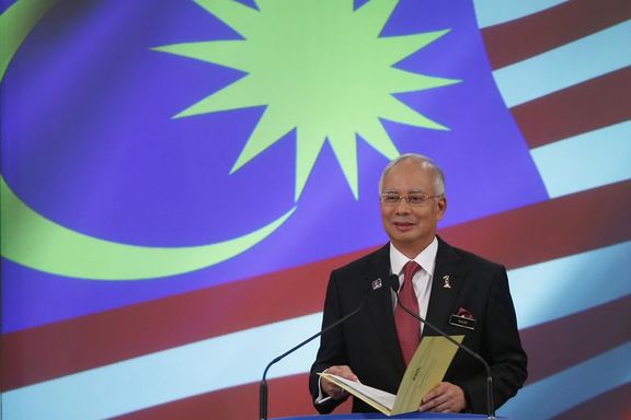 Malezya büyüme beklentisini düşürdü